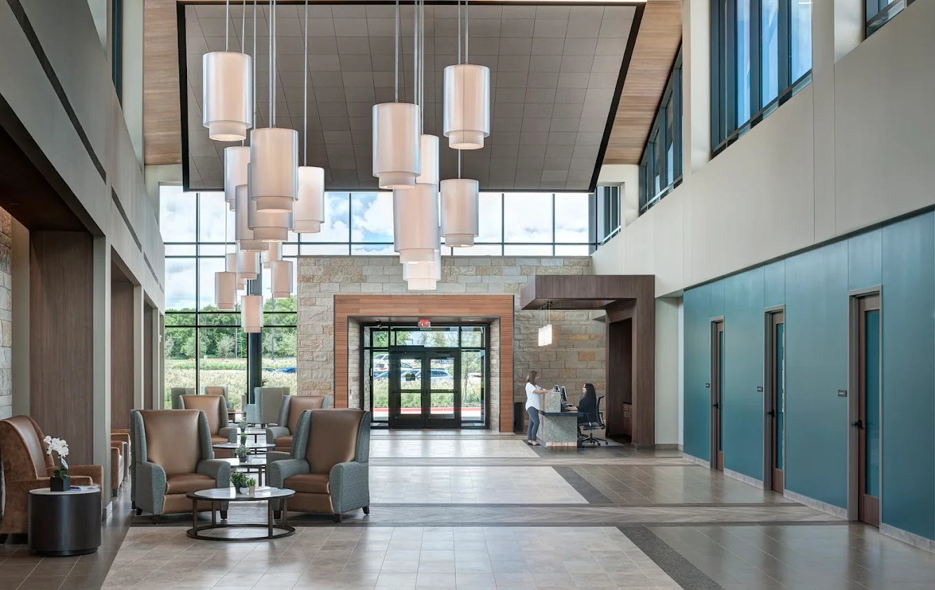 Spacious reception lounge with modern seating and high ceilings