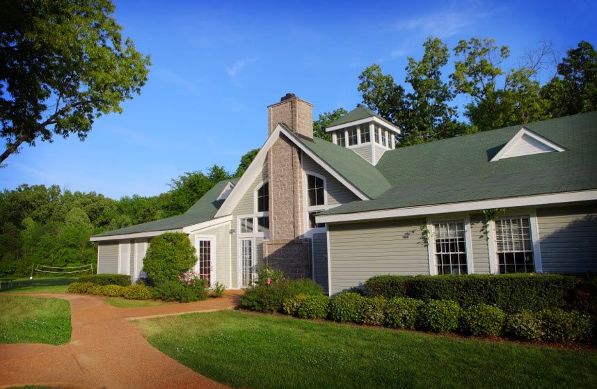 Residential lodge surrounded by landscaped grounds