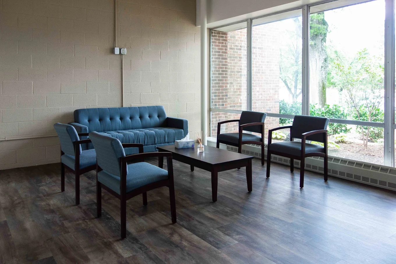 Lounge with blue sofa and window view