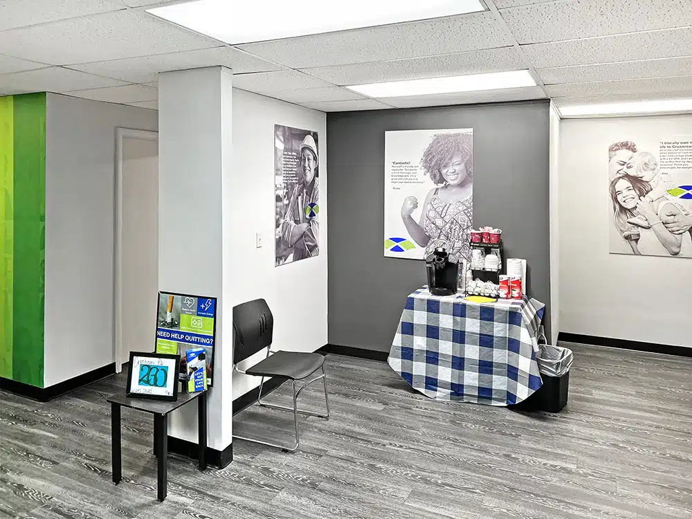 Lobby with chairs, posters, and small table display
