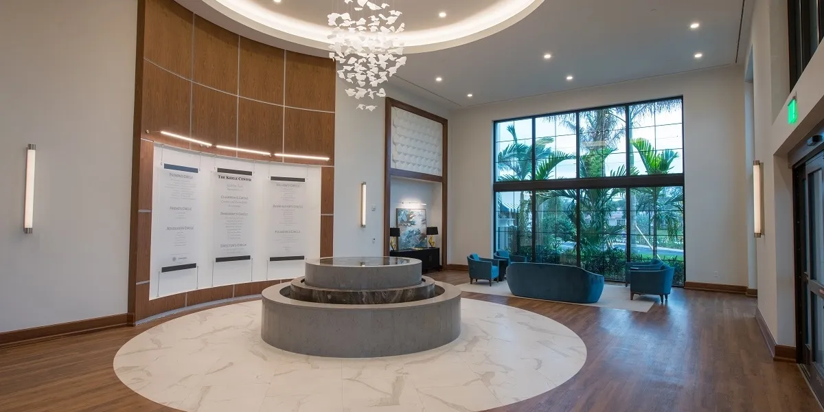 Spacious lobby with sculpture and floor-to-ceiling windows