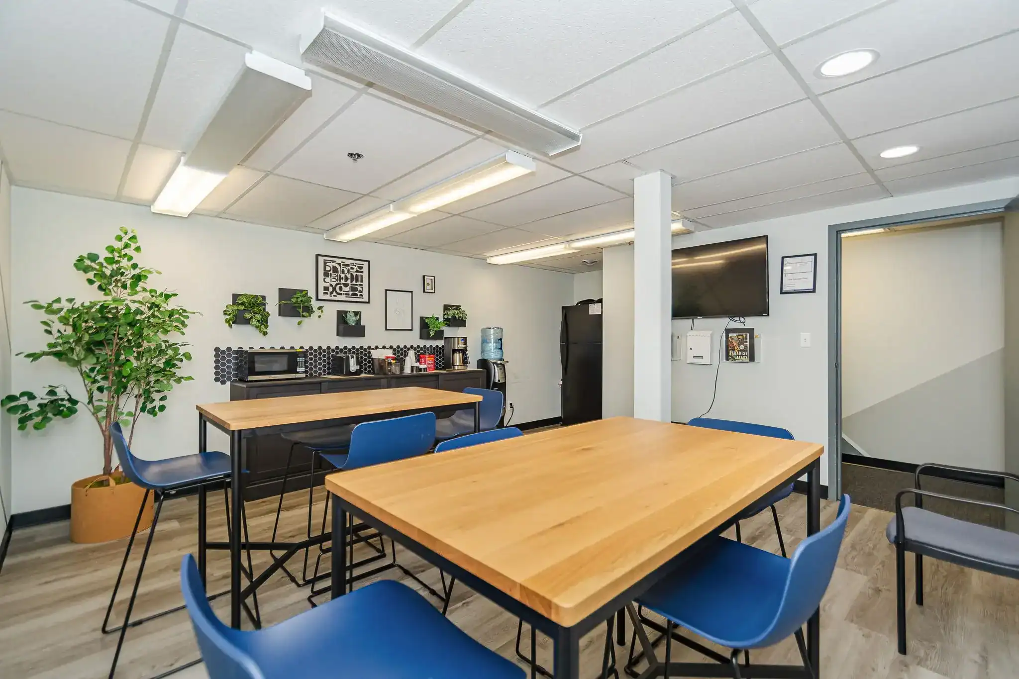 Community room with tables and refreshment area
