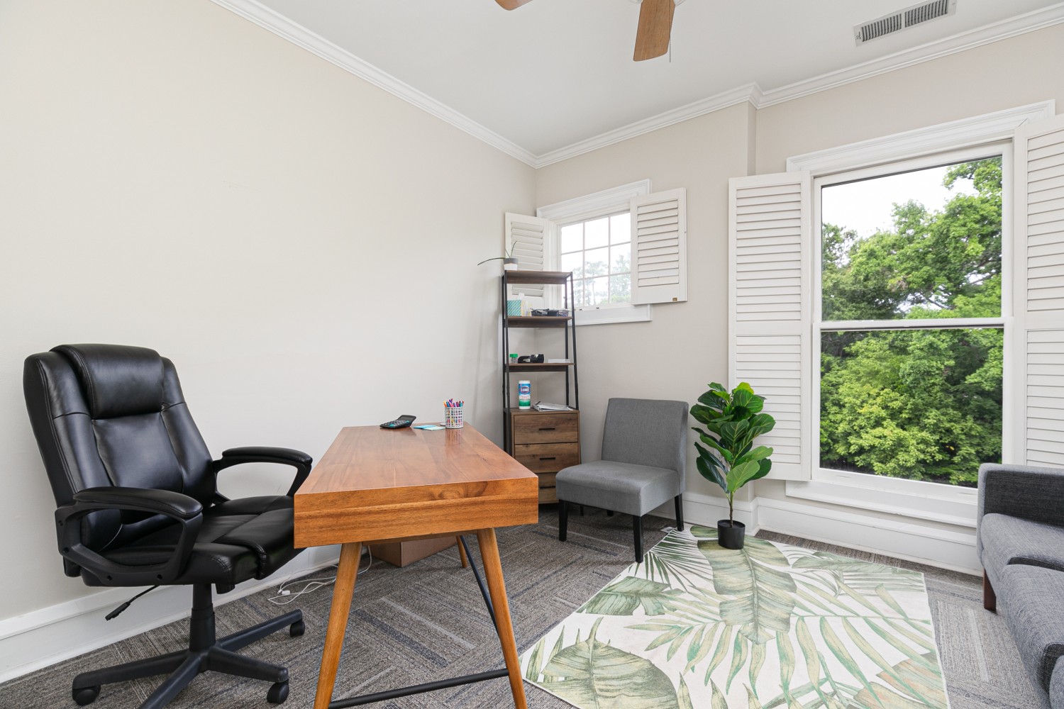 Private counseling room with desk and window view