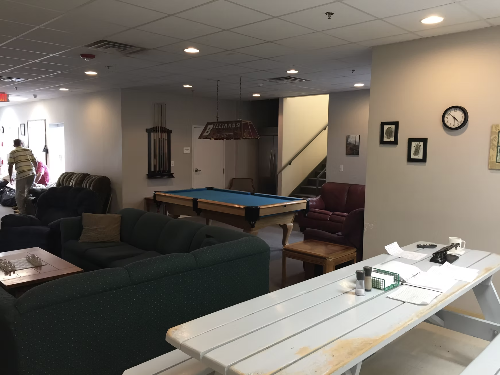 Recreation lounge with a billiards table and seating at Serenity Place in Dover
