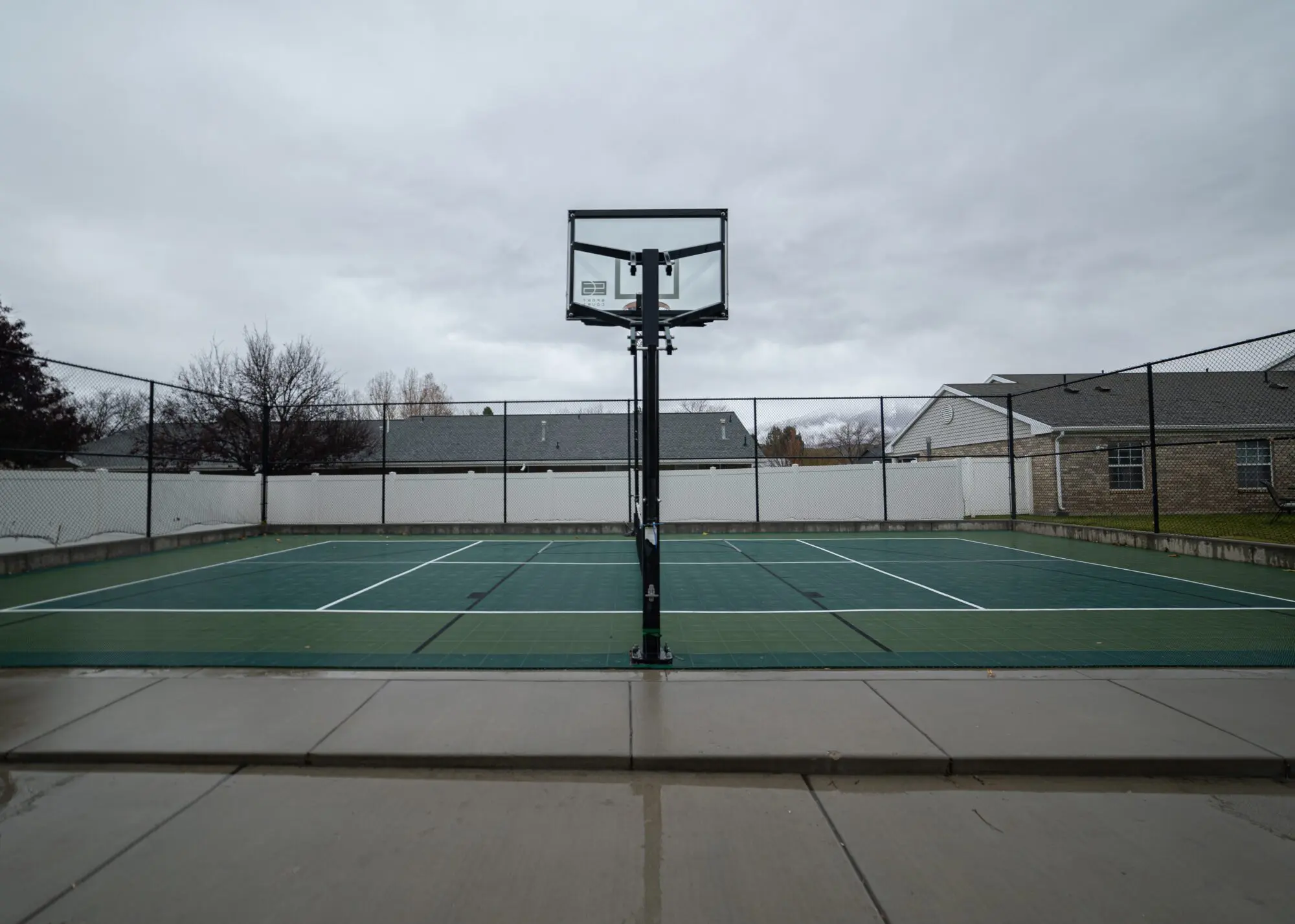 Outdoor tennis and basketball court at Steps Recovery Center