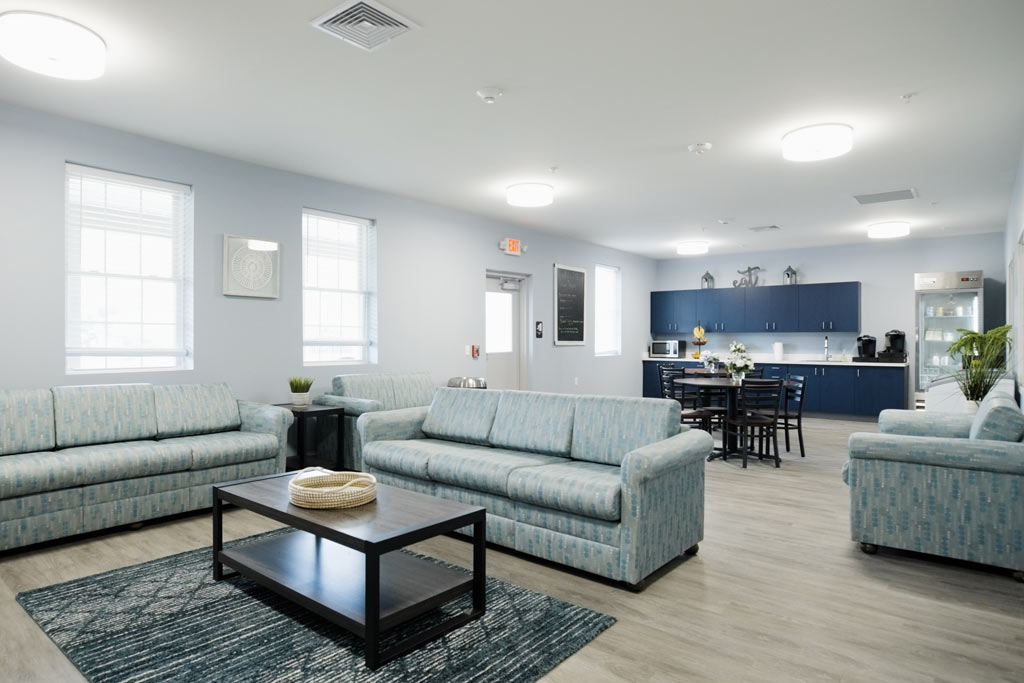 Lounge with light blue sofas and dining area