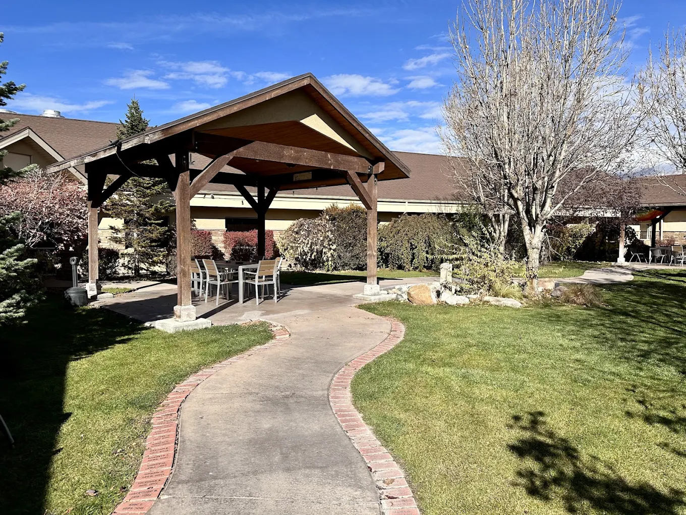 Peaceful outdoor area with gazebo, trees, and walking path at New Roads Behavioral Health