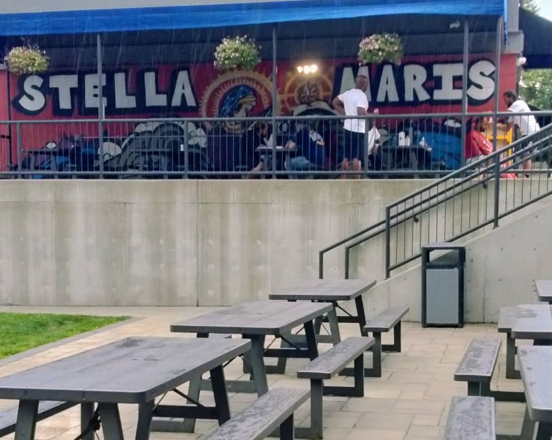 Outdoor picnic seating near the Stella Maris patio