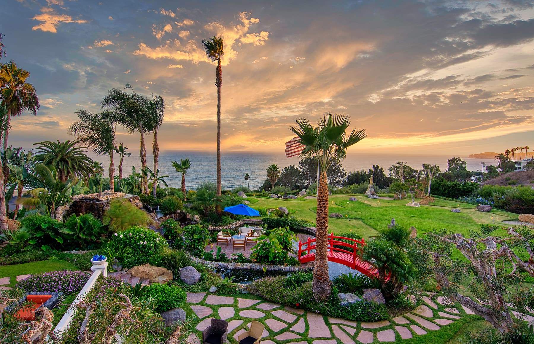 Ocean-view courtyard with landscaped gardens and seating