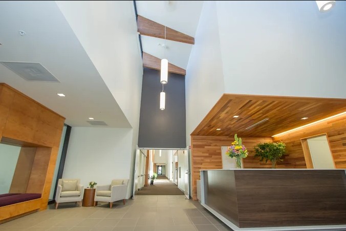 Modern lobby with reception desk and seating area