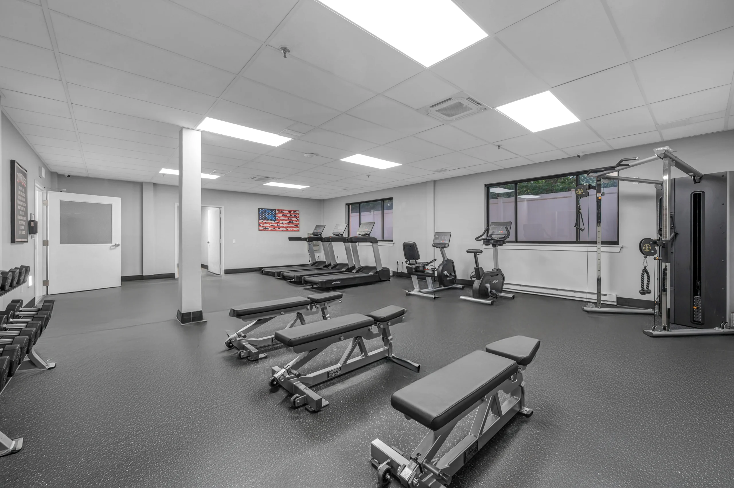 Fitness room with treadmills, weights, and exercise equipment at Boca Recovery Center Massachusetts