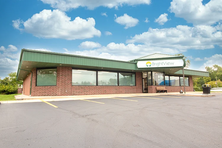 Brick BrightView facility with sign and parking lot
