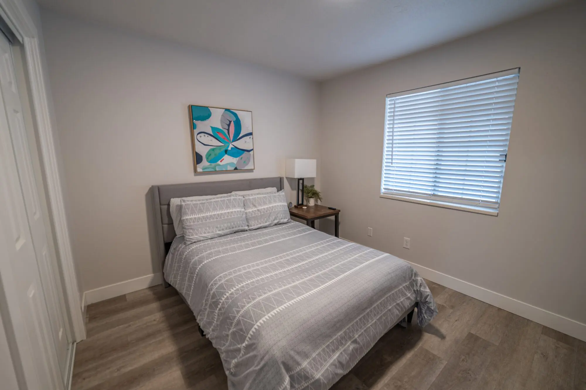 Private residential bedroom with bed and natural light