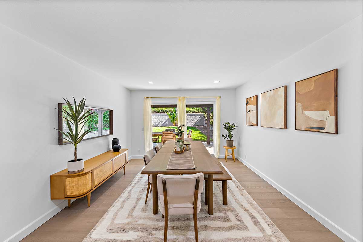 Spacious dining room with long table and garden access