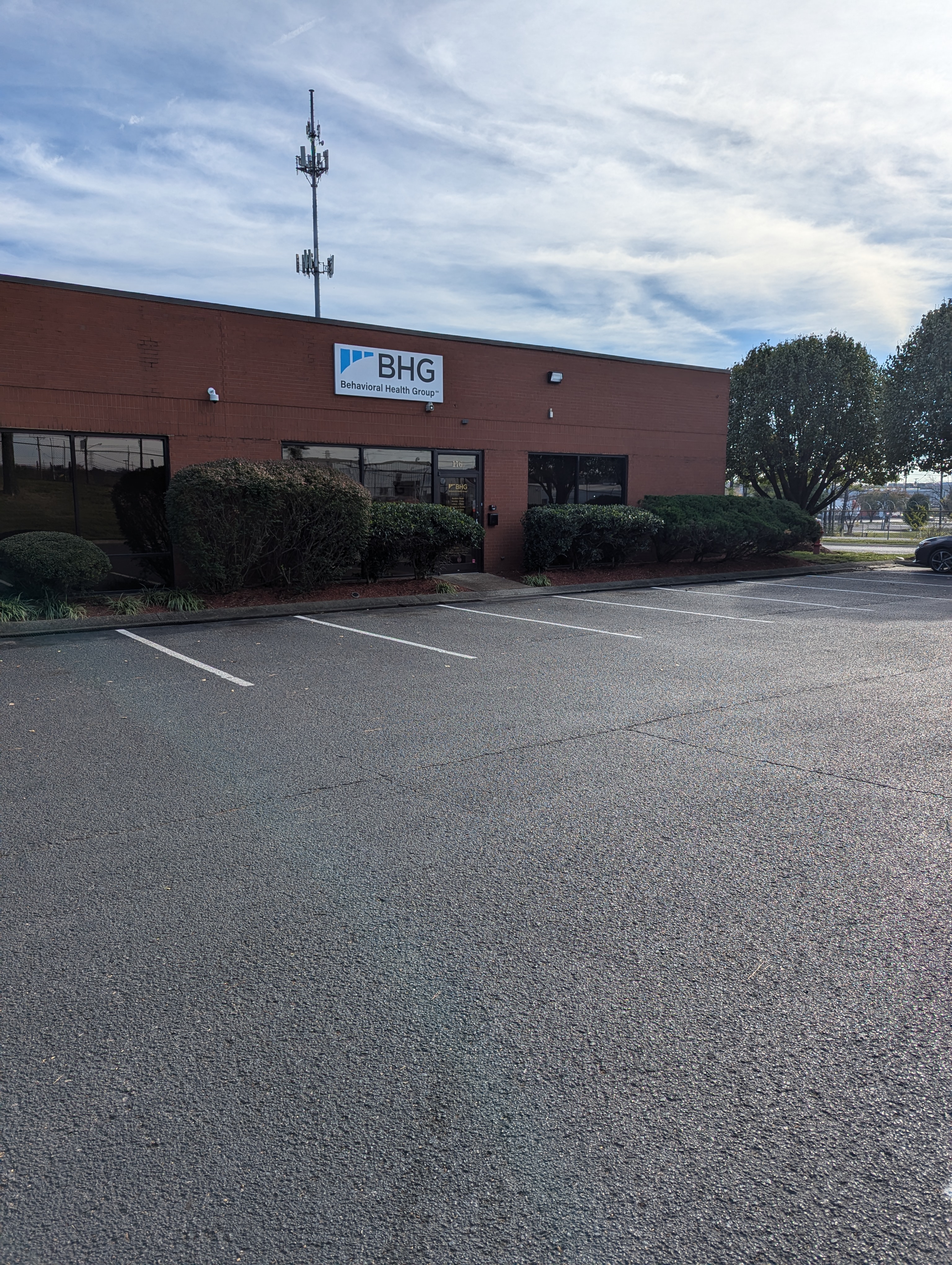 Exterior of BHG Madison Treatment Center with parking lot