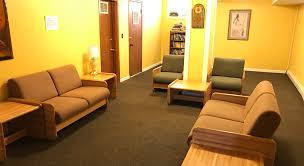 Shared lounge with couches and seating for residents