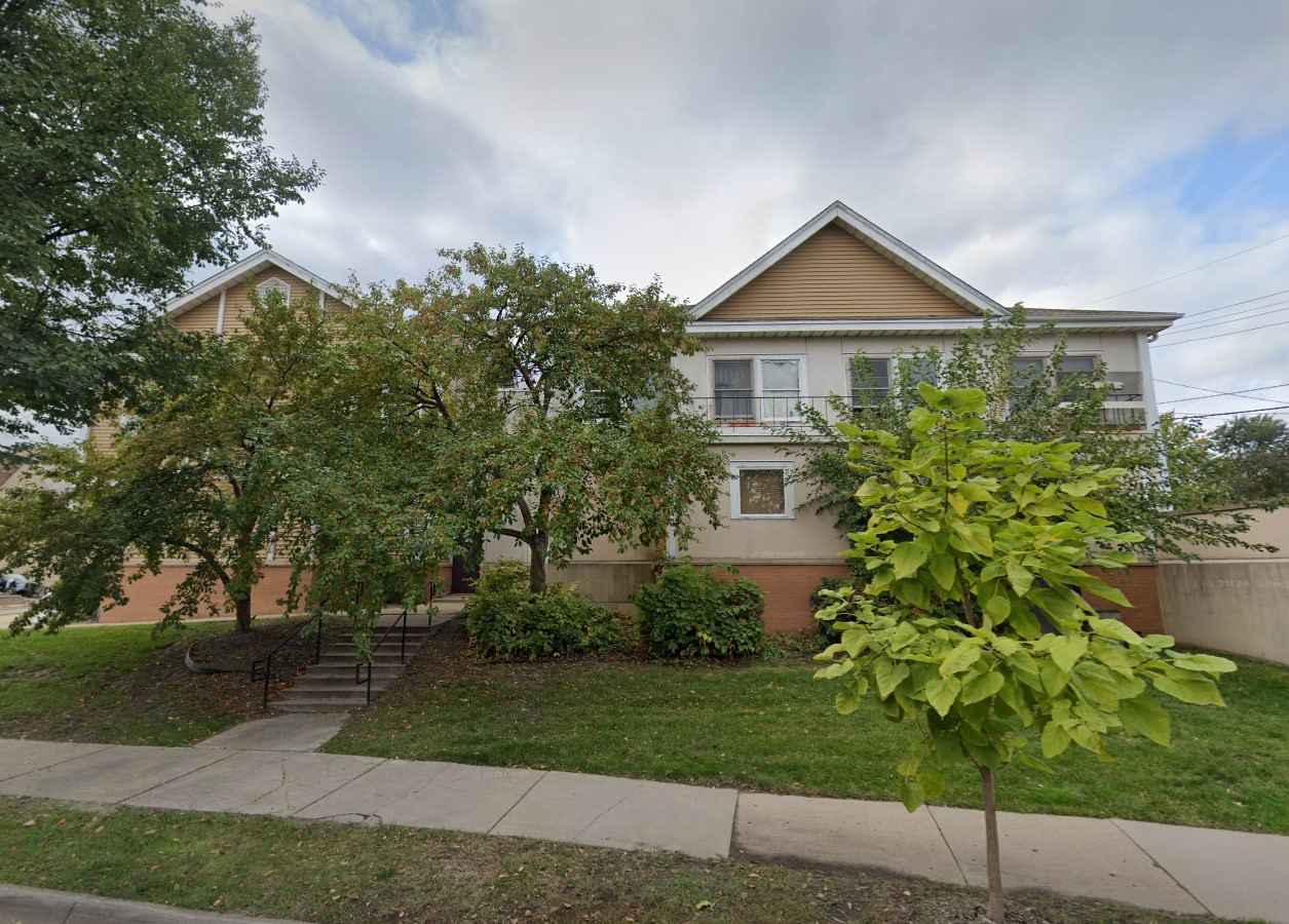 Exterior side street view of rehab facility with secondary entrance.