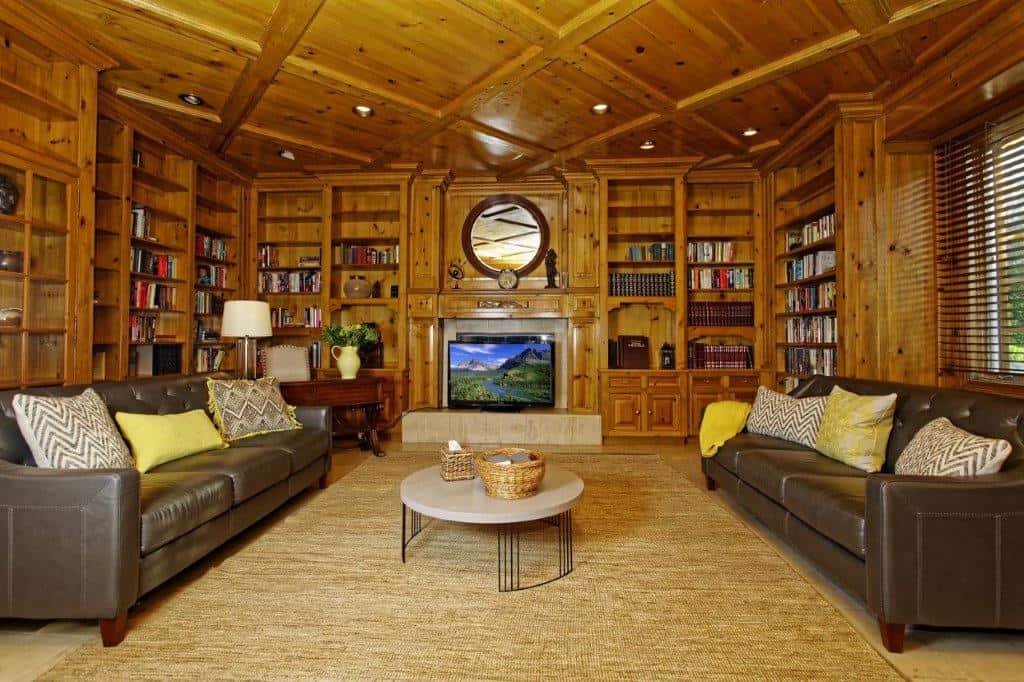 Cozy reading room with bookshelves and sofas