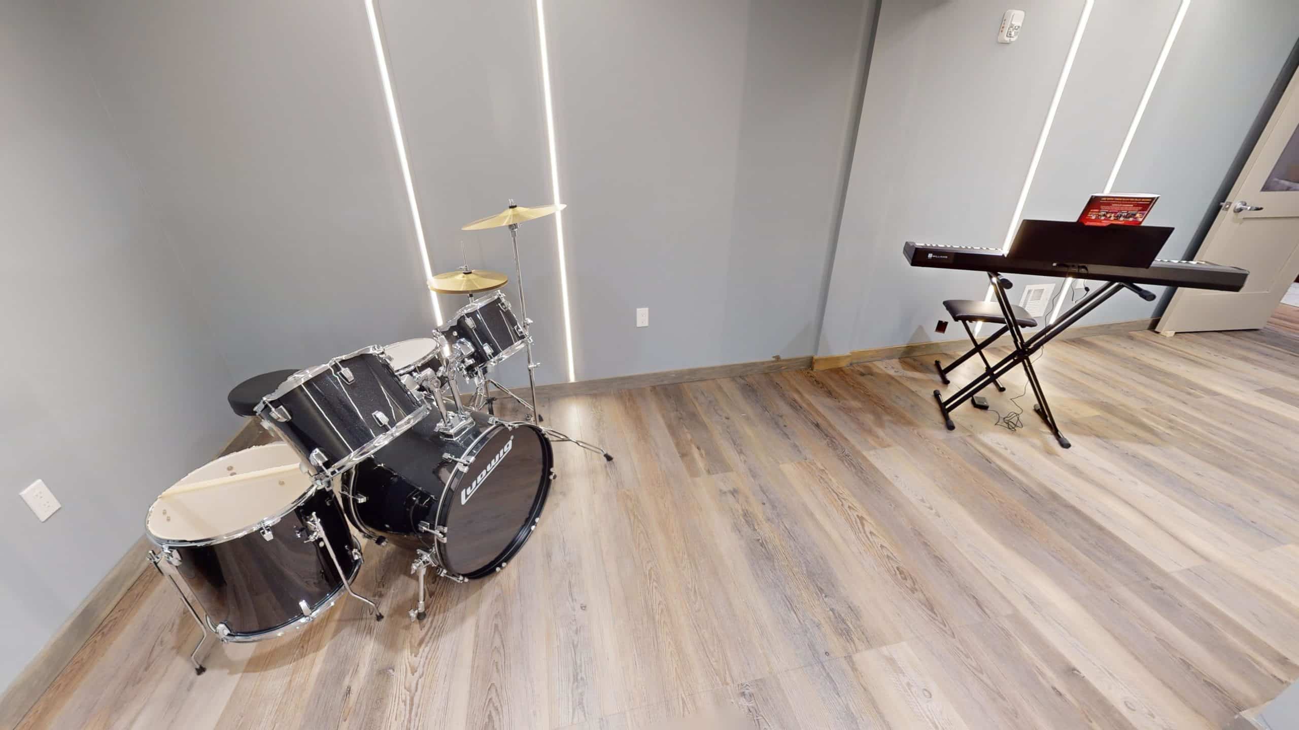 Music room with drum set and keyboard for therapy sessions