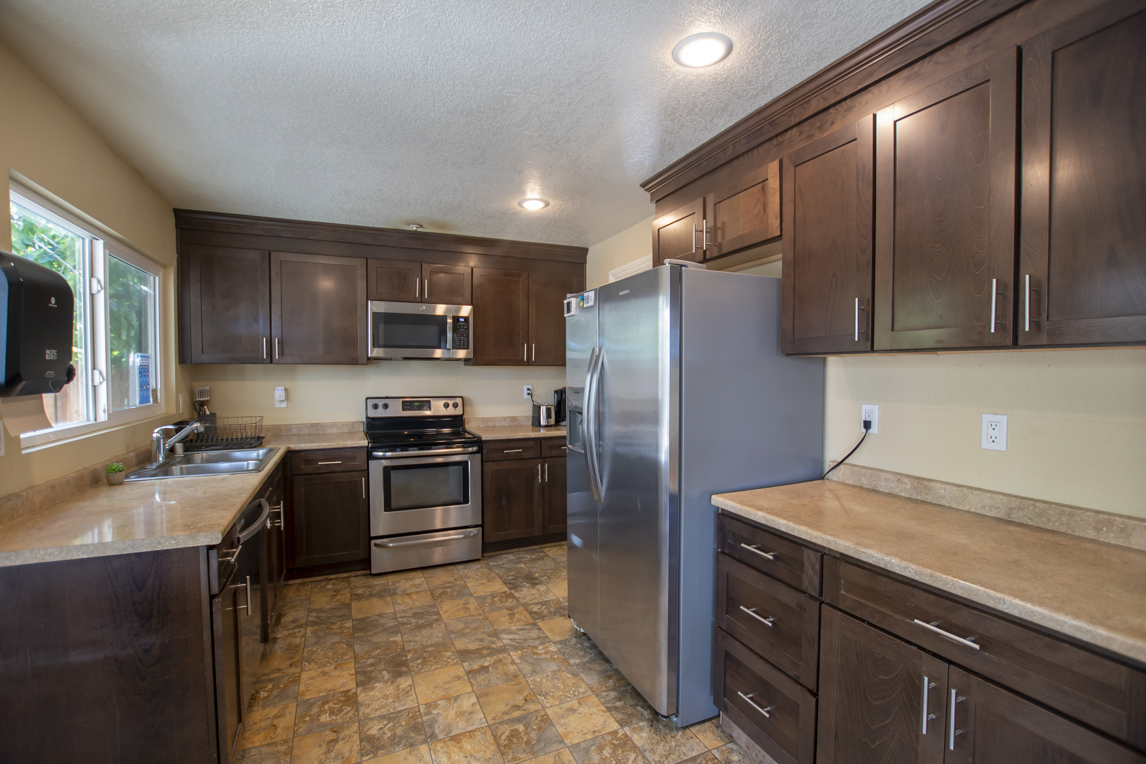 Kitchen with stainless steel appliances and wood cabinets