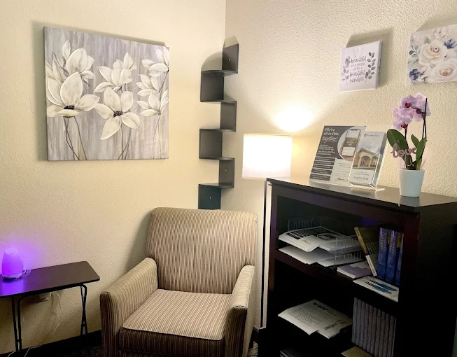 Private counseling room with chair and bookshelf