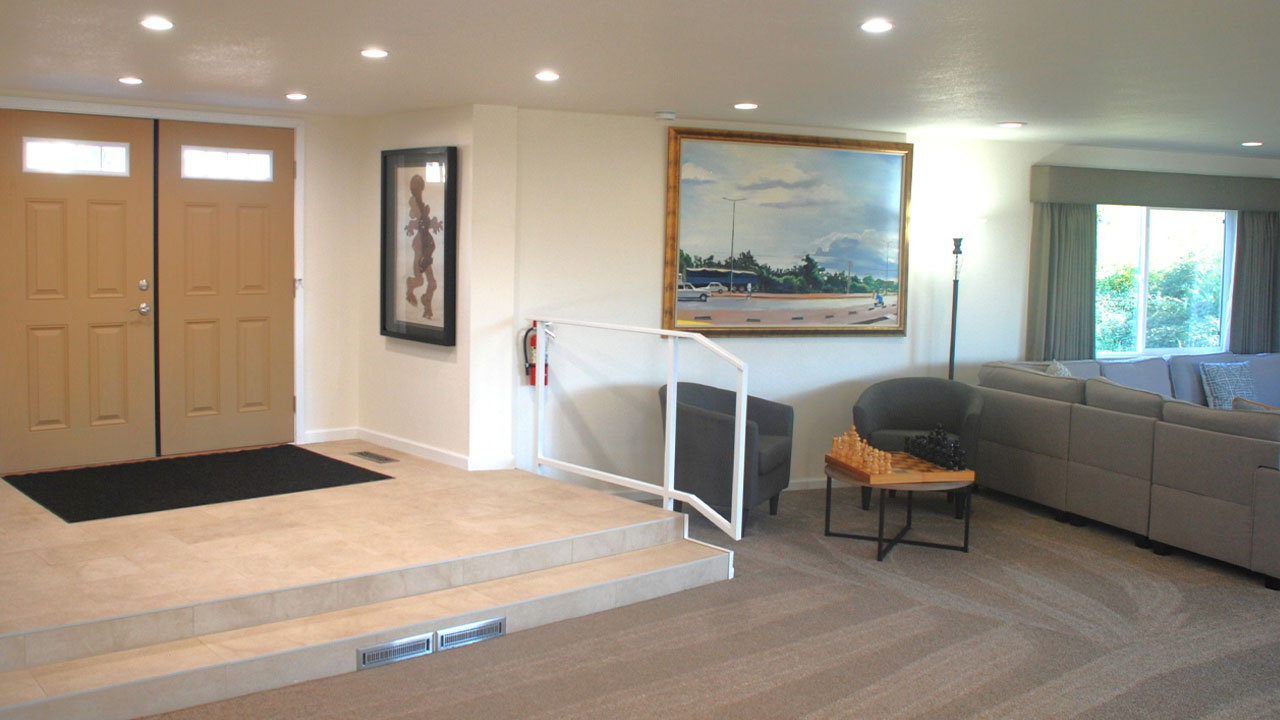 Double-door entrance with stairs and seating