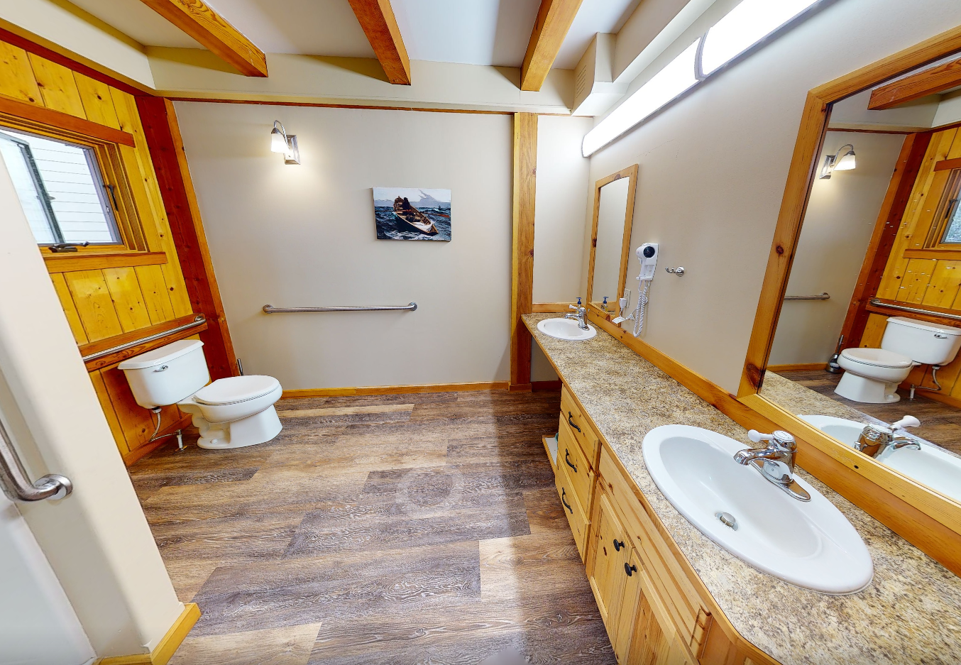 Cozy comfort room with chairs, fireplace, and outdoor views