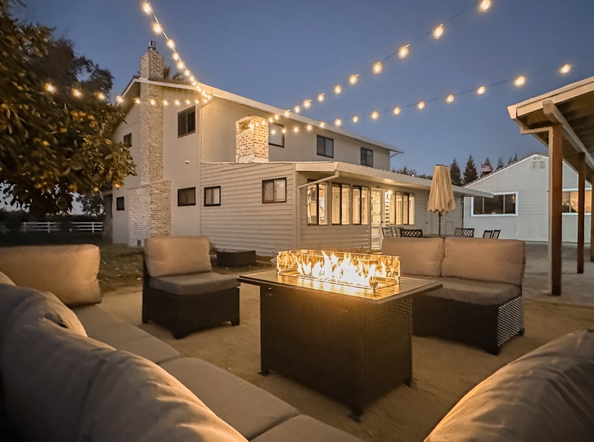 Outdoor patio with fire pit and lounge seating
