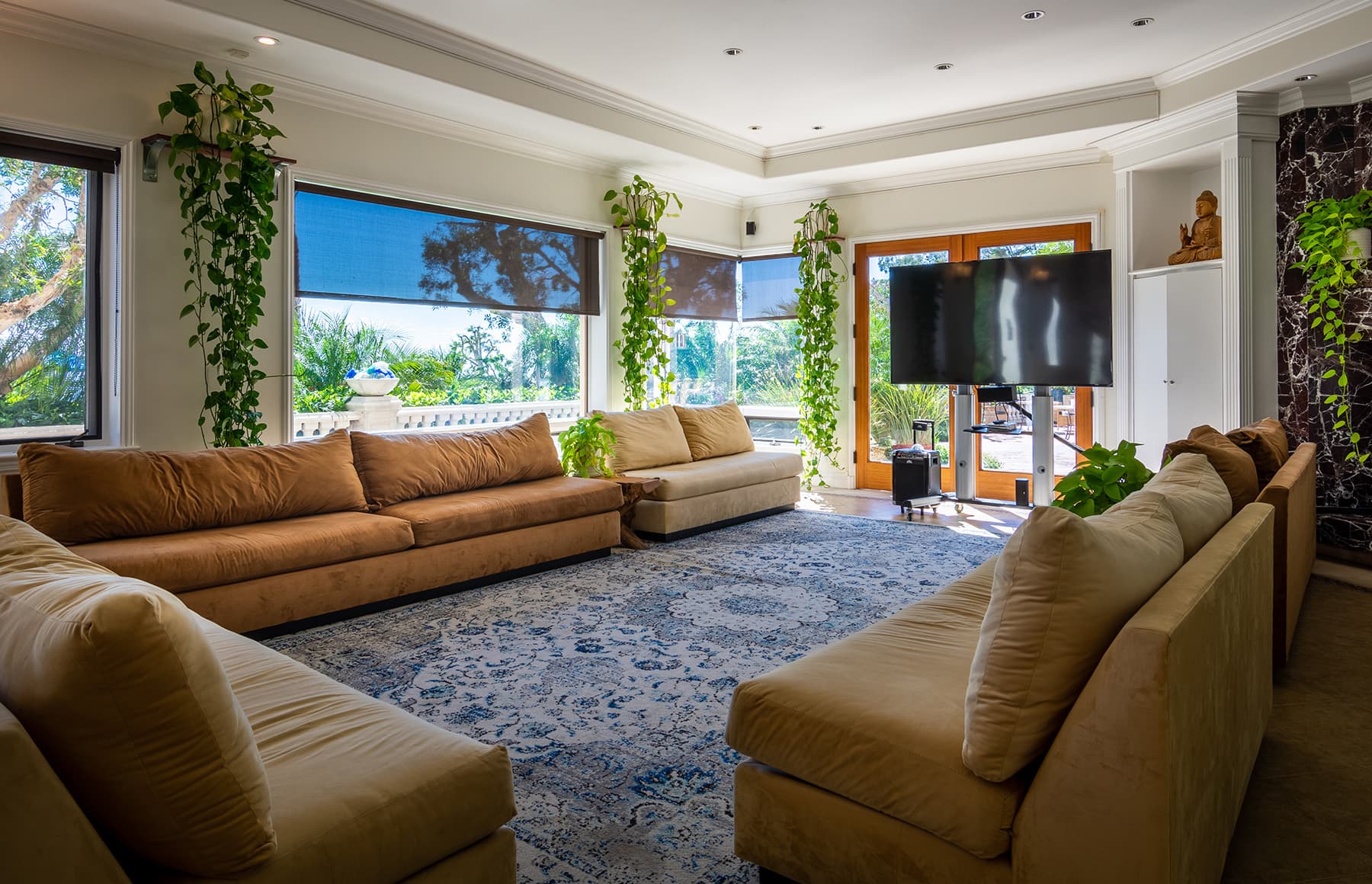 TV lounge with couches and large screen television