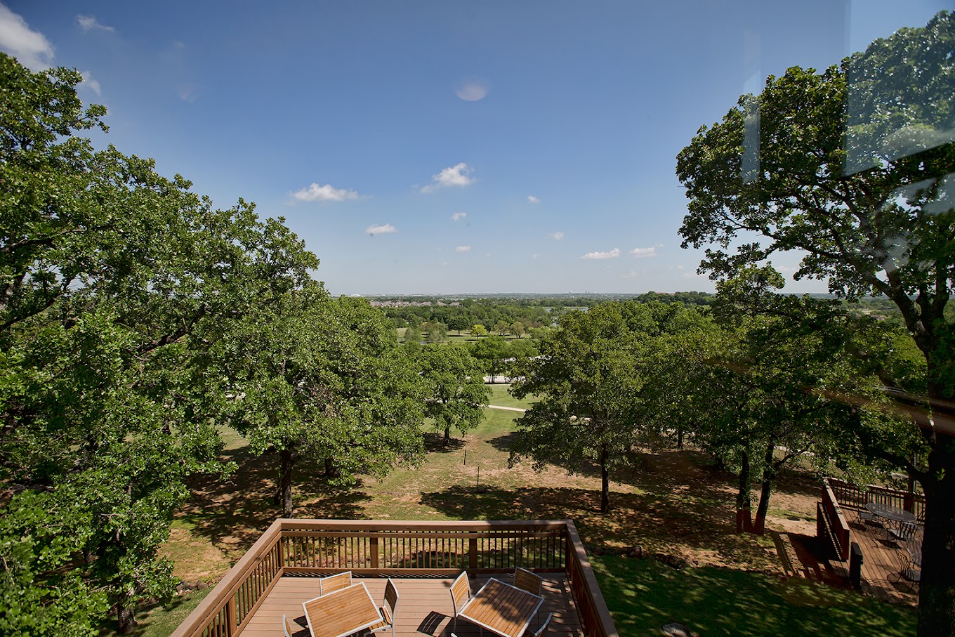 Elevated deck overlooking a lush green landscape