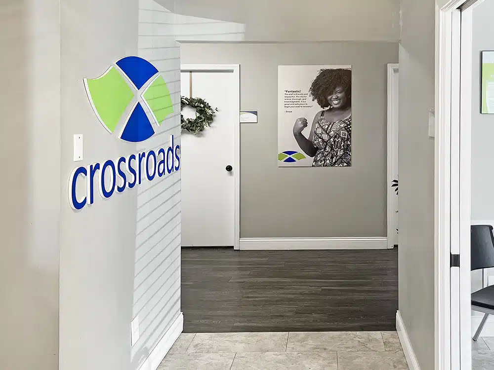 nterior hallway with Crossroads logo and patient rooms