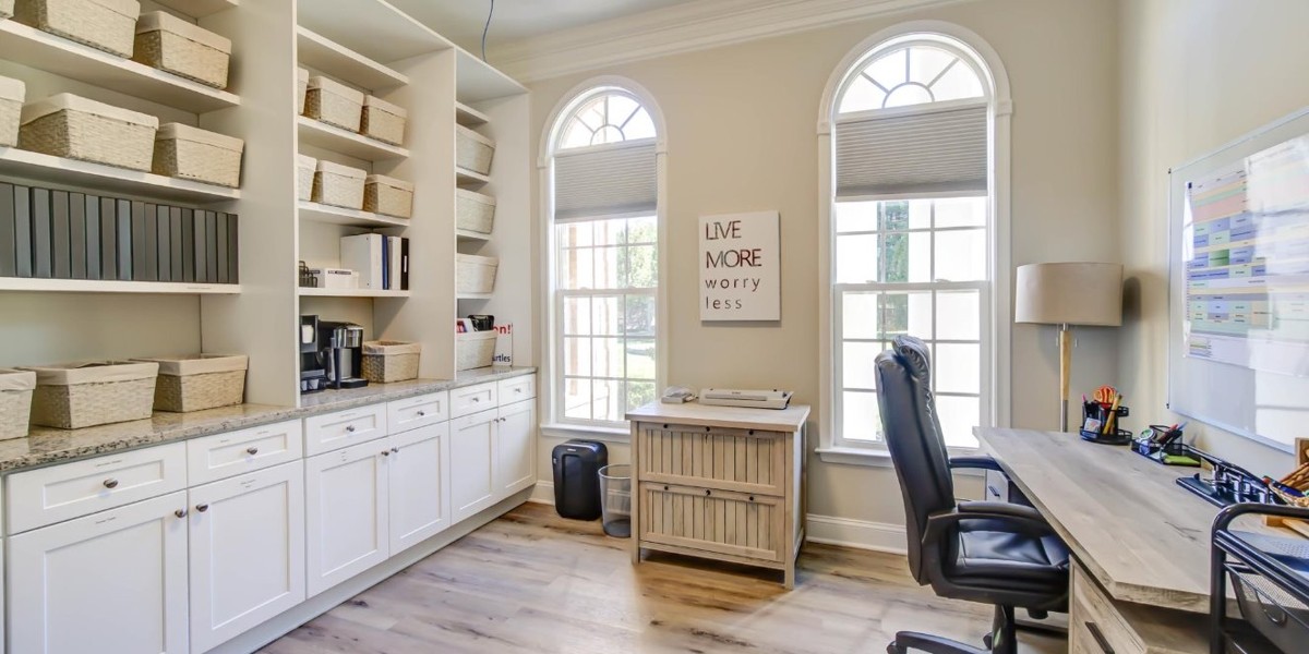 Office with desk, storage shelves, and motivational wall art