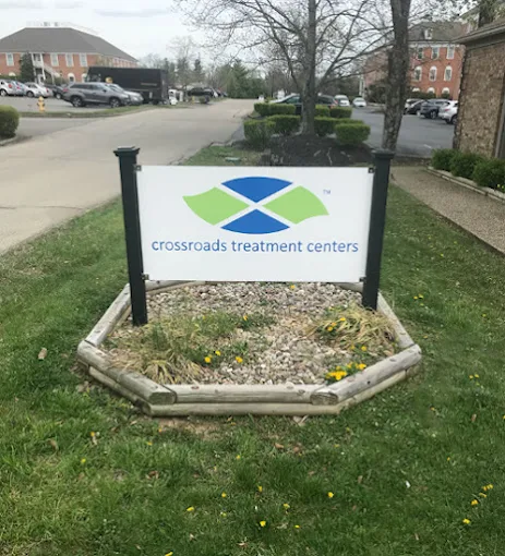 Outdoor sign for Crossroads Treatment Center on lawn