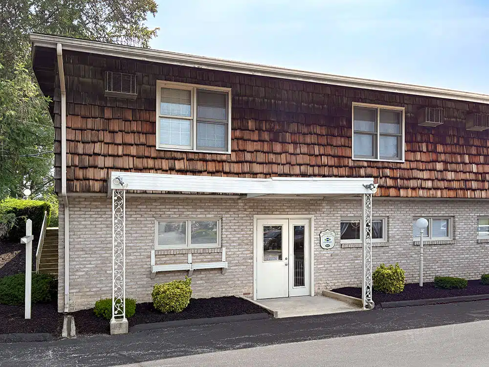 Exterior of clinic building with covered entrance door