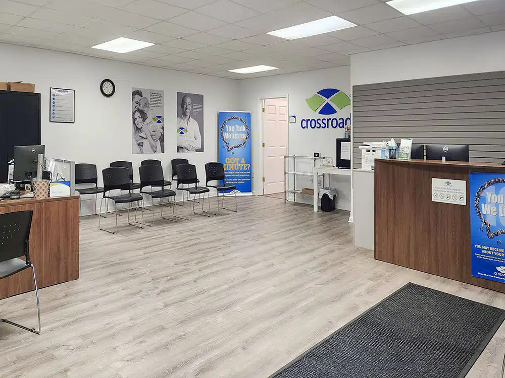 Waiting area with chairs and posters at Crossroads clinic