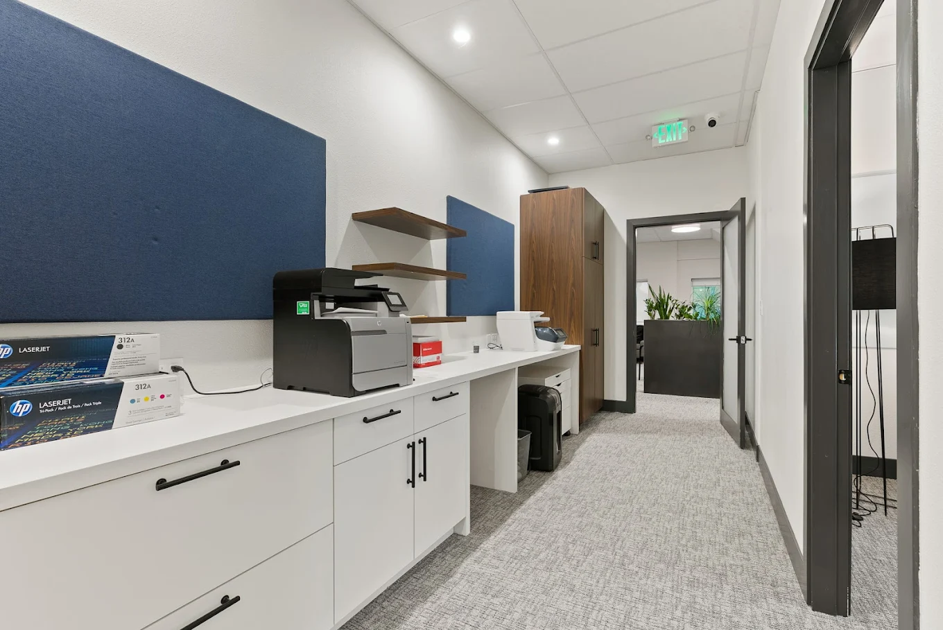 Business center with printer, workspace, and storage