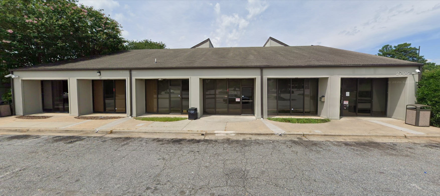 Exterior view of treatment center building with parking area