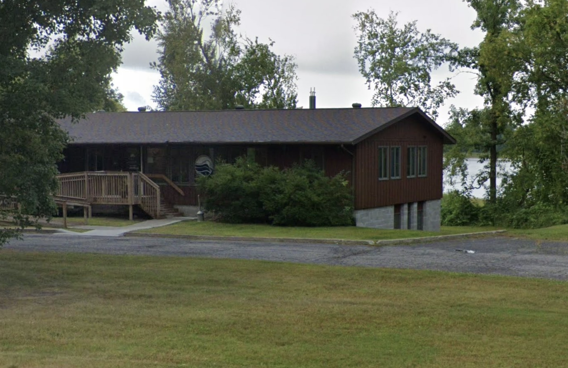 Exterior of residential facility surrounded by trees