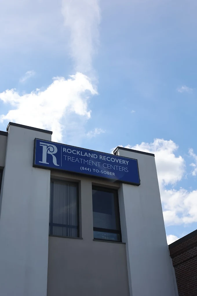 Exterior building with Rockland Recovery sign and blue sky