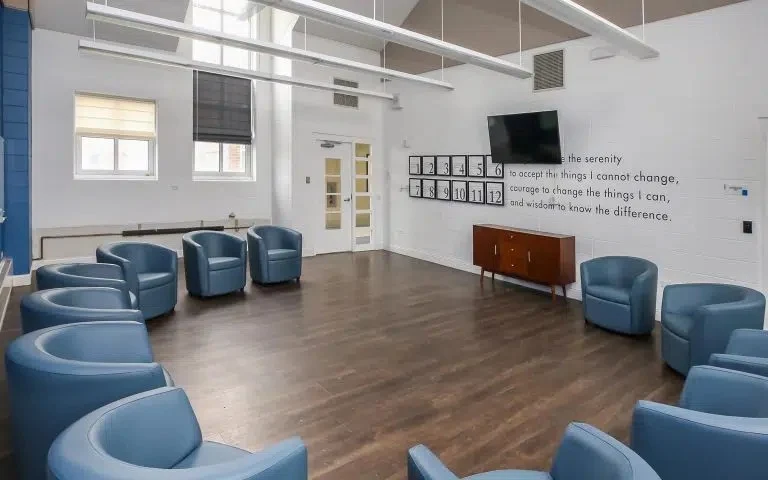 Group meeting room with blue chairs arranged in a circle
