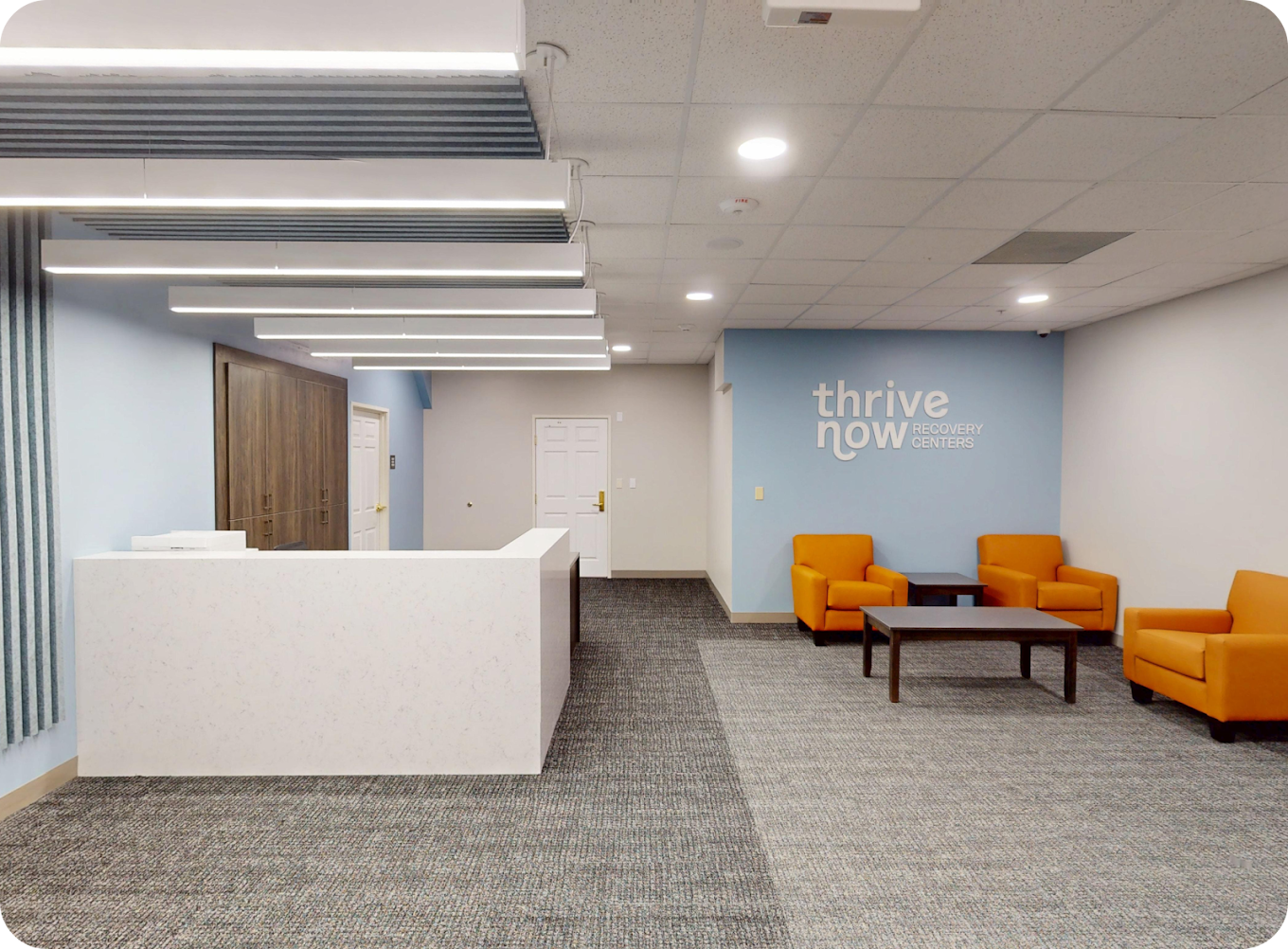 Modern reception desk with comfortable waiting area