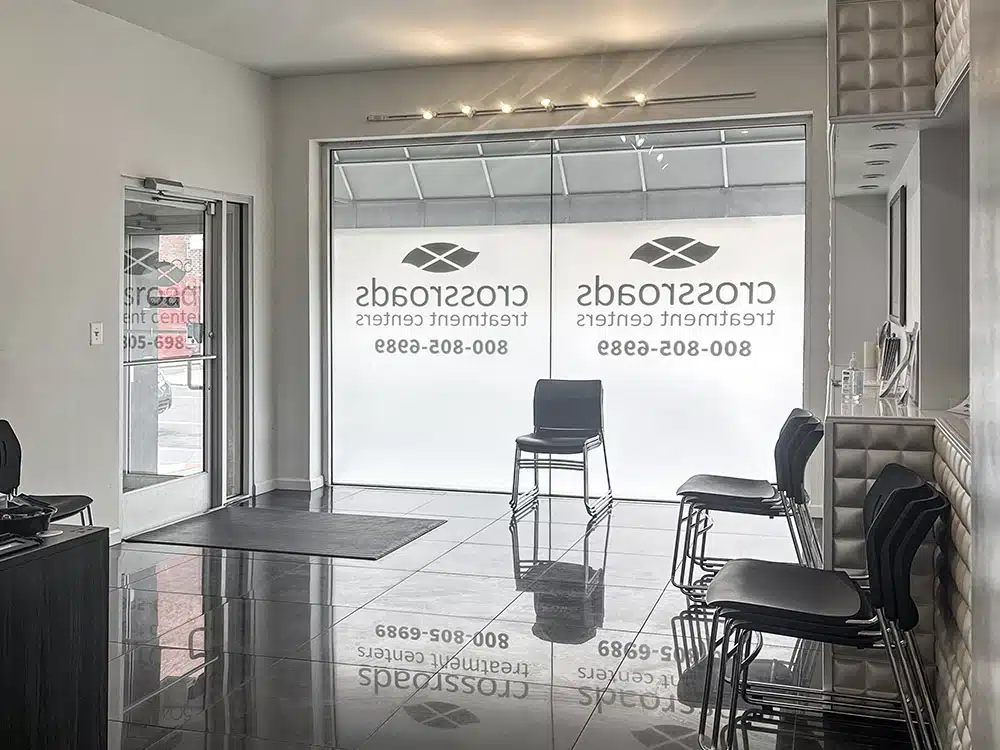 Waiting area with chairs and large frosted windows