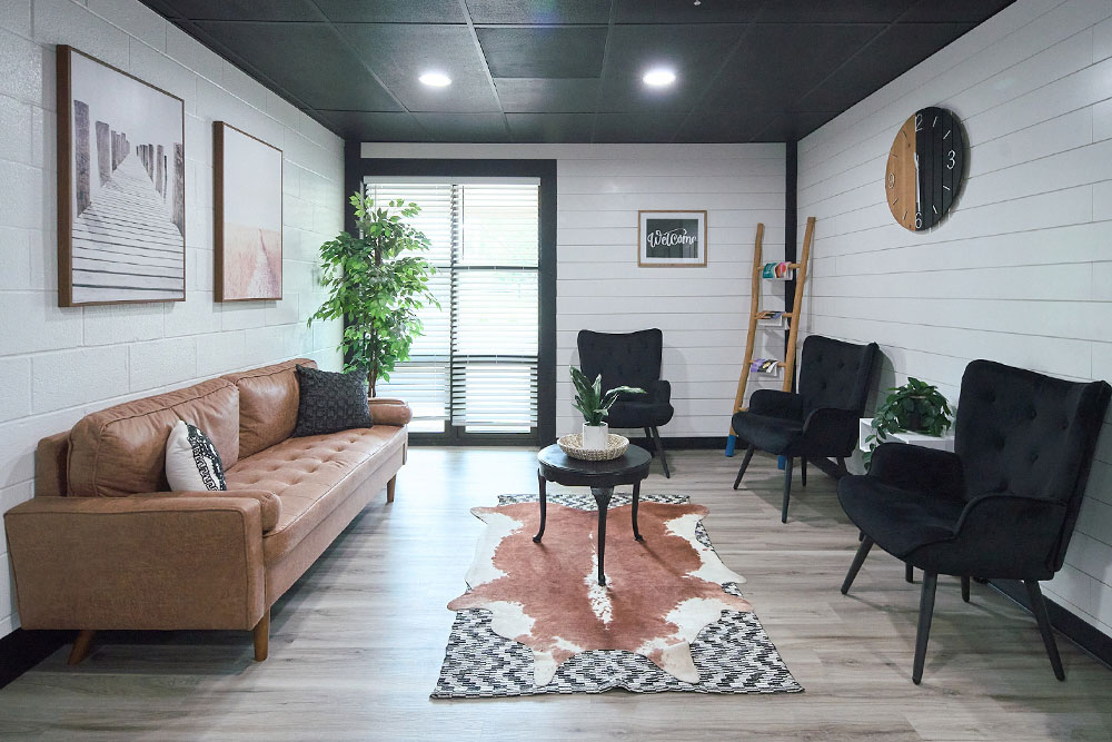 Cozy room with couch, armchairs, and coffee table