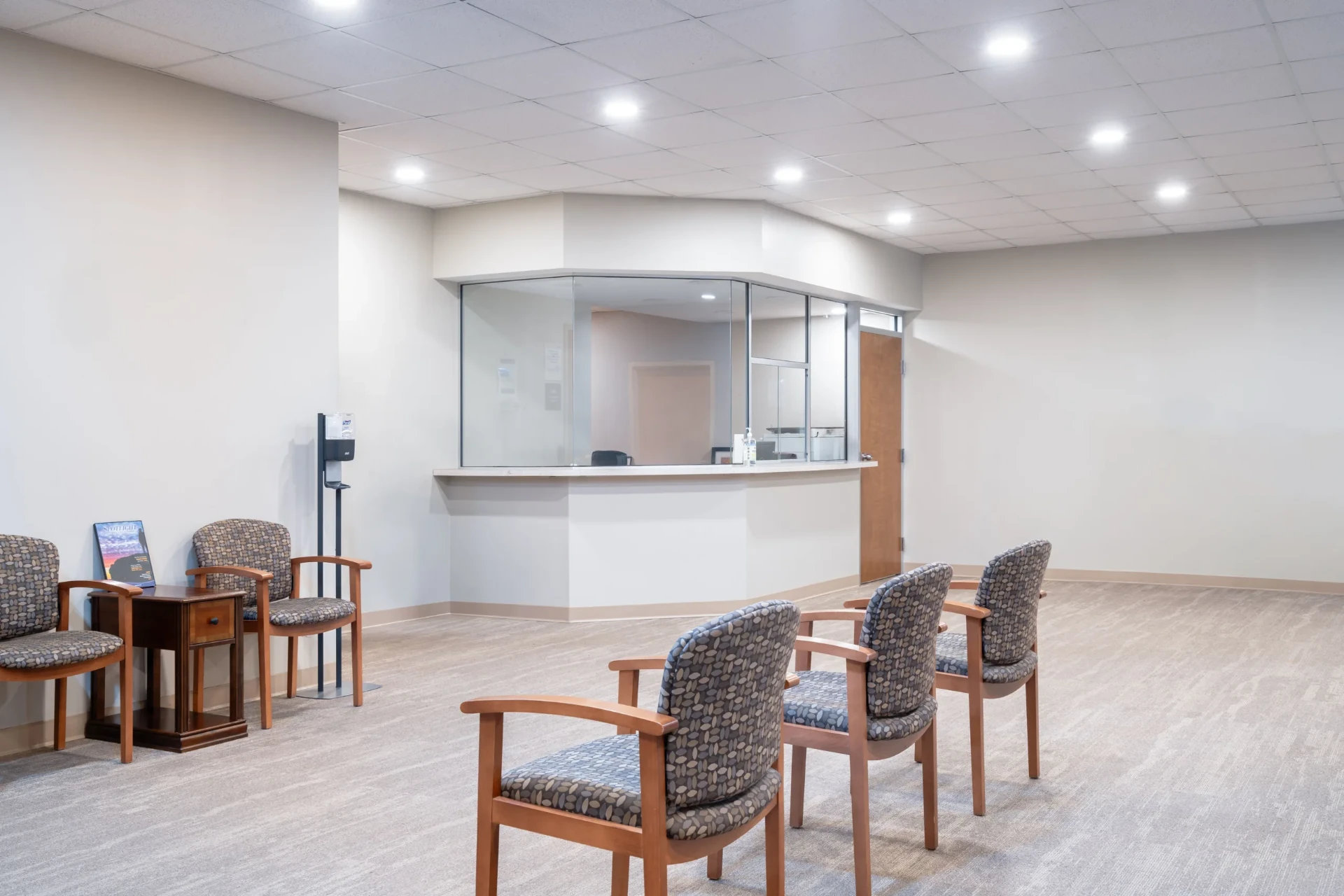 Reception area with waiting chairs and front desk