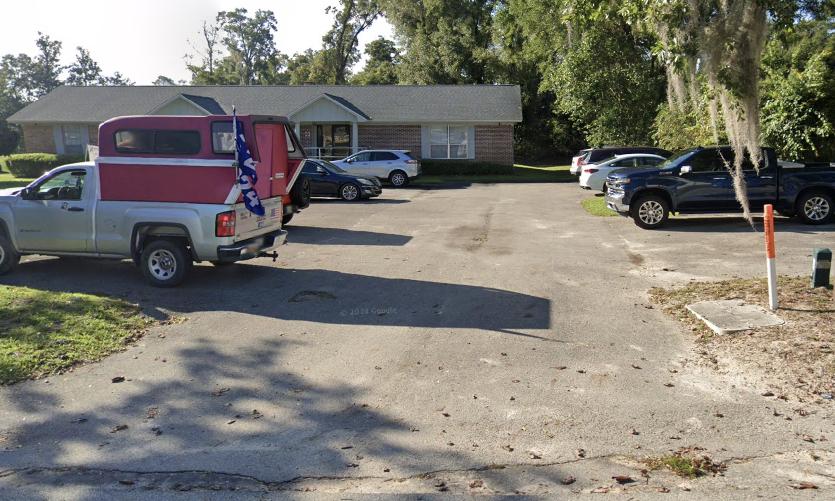Parking lot facing Disc Village clinic building and entrance