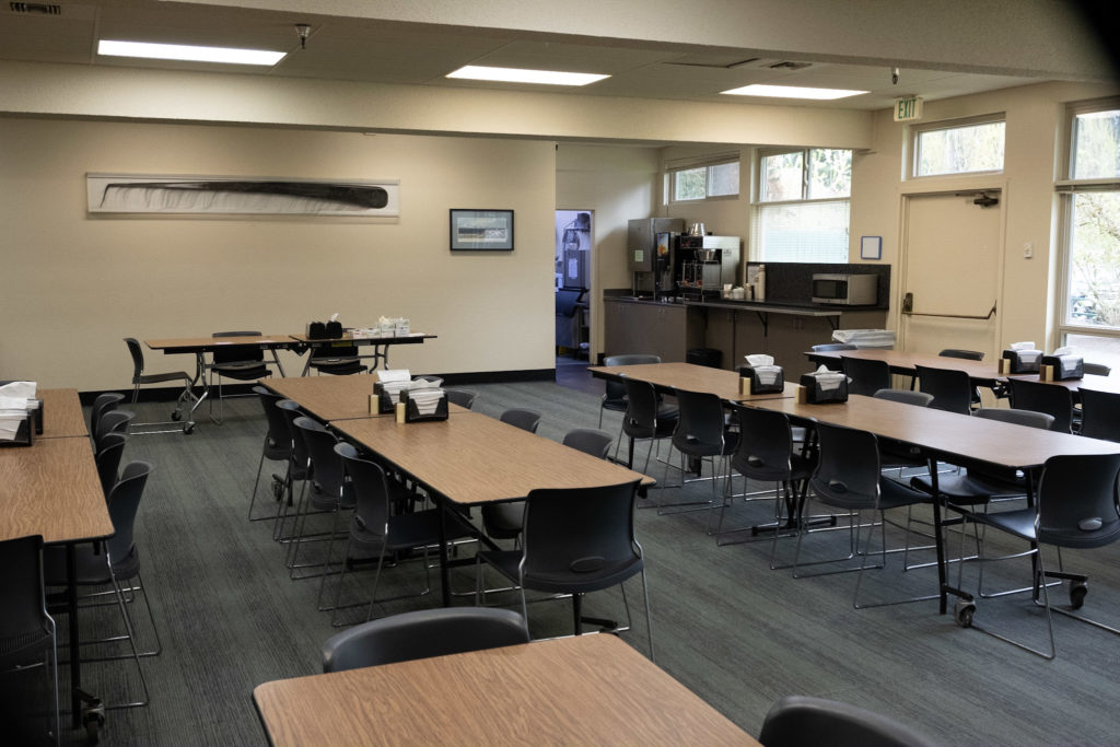 Dining room with tables, chairs, and beverage station