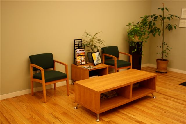 Waiting area with chairs, plants, anWaiting area with chairs, plants, and reading materialsd reading materials