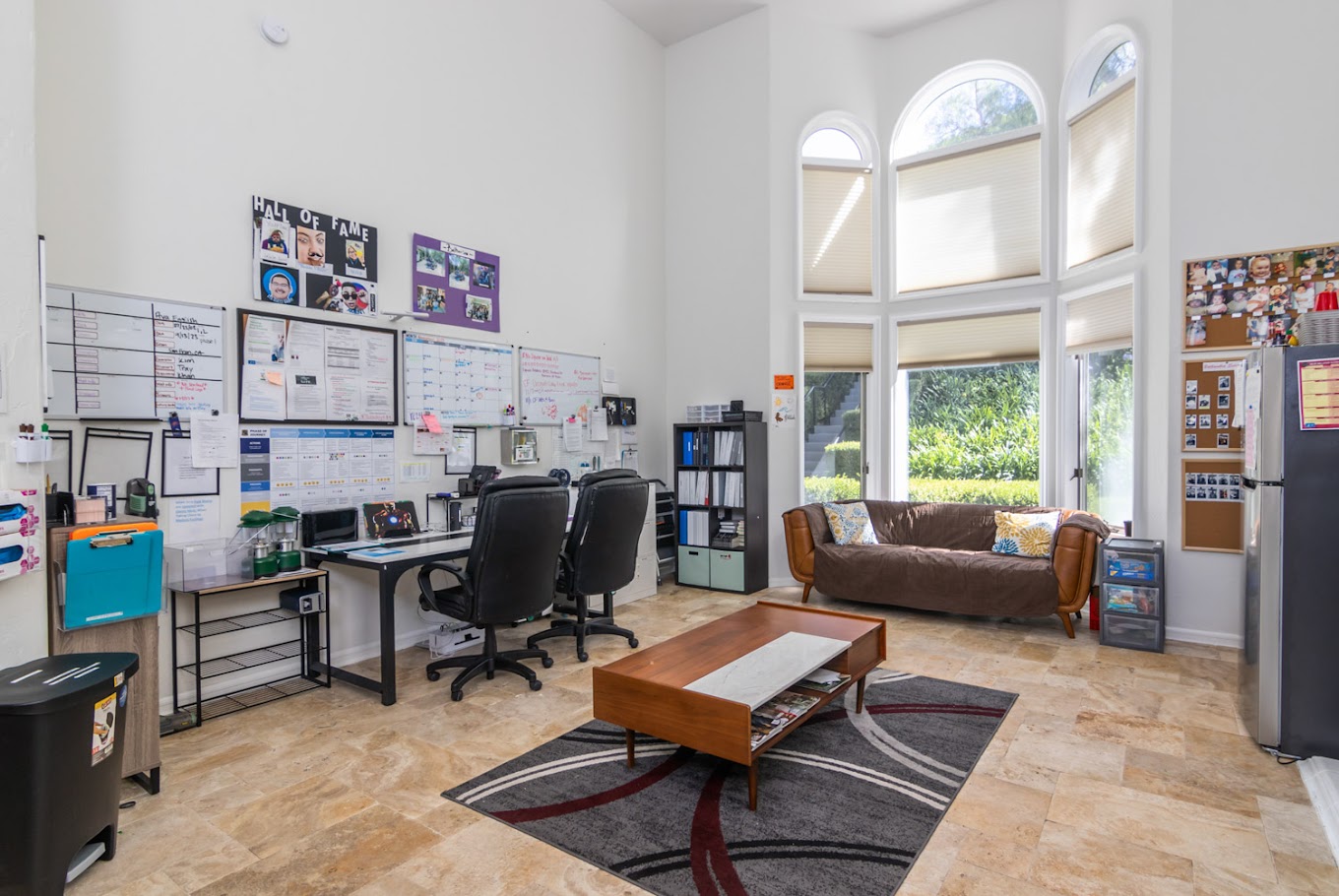 Office space with desks and a couch.
