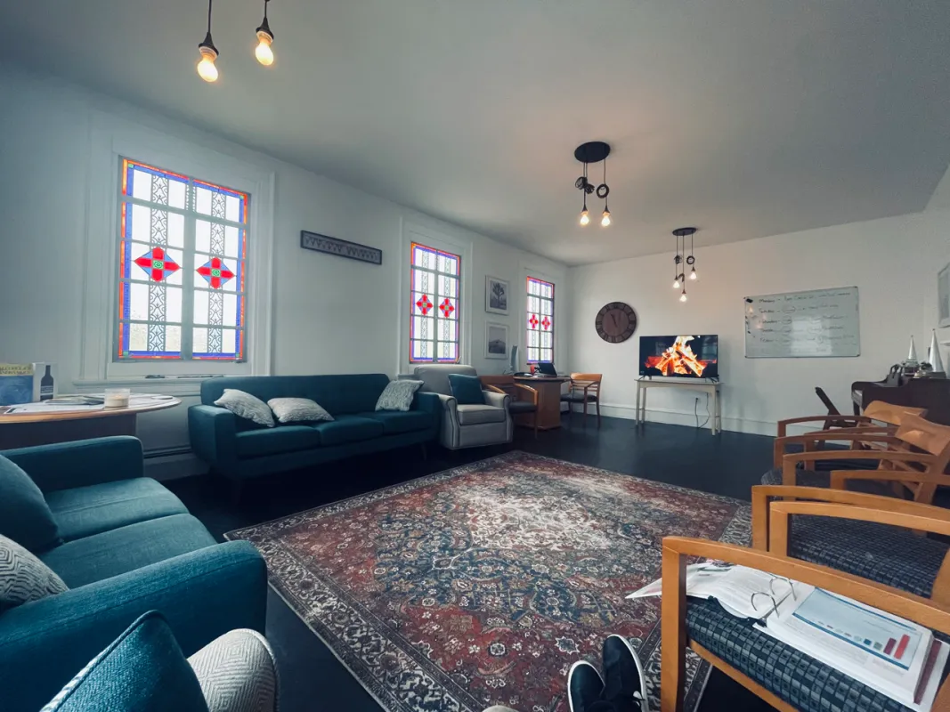 Lounge with sofas and stained glass windows