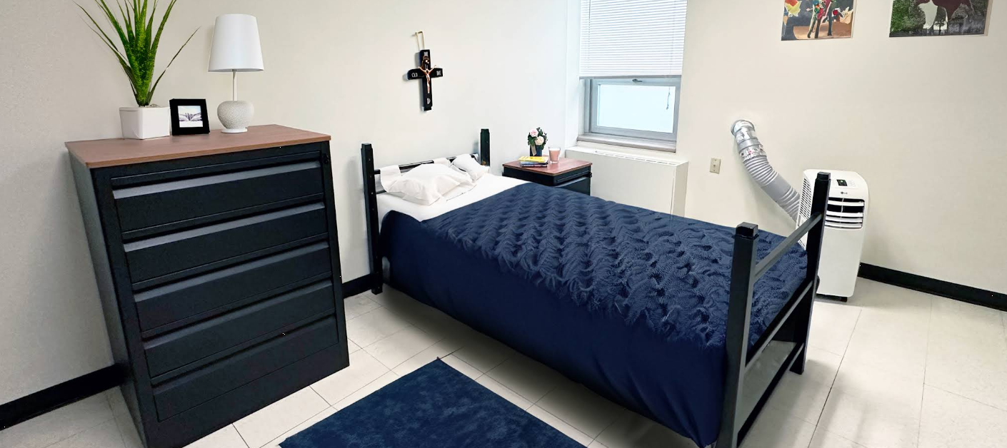 Private bedroom with single bed, dresser, and bedside table